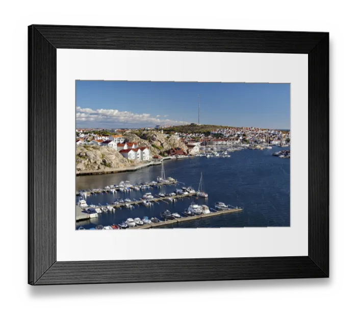 Framed Print : View over archipelago, town with white houses and jetty for leisure and fishing boats