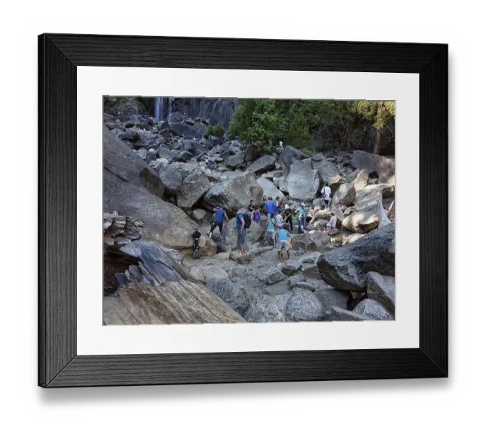 Framed Print : Tourists on boulders, climbing