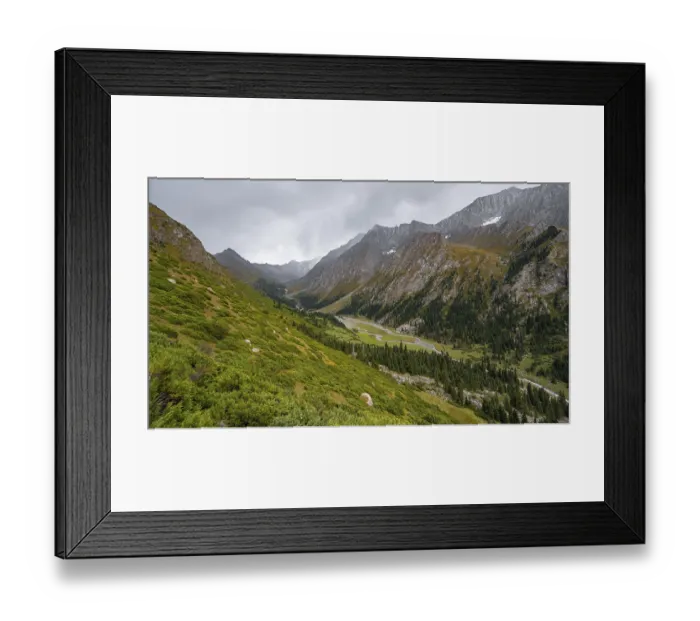 Framed Print : Green mountain valley with river and steep mountain peaks