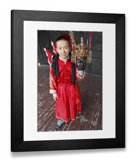 Framed Print : Mask dancer in Ci-Yun Temple holding a traditional mask
