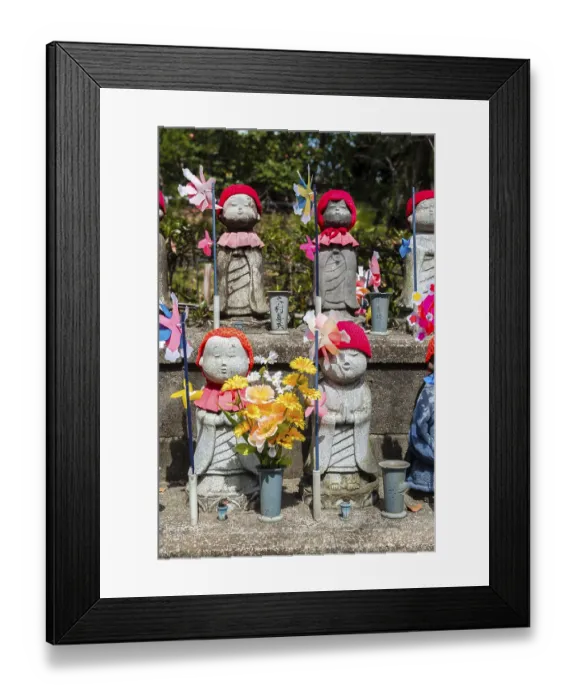 Framed Print : Jizo statues with red caps, protective deities for deceased children