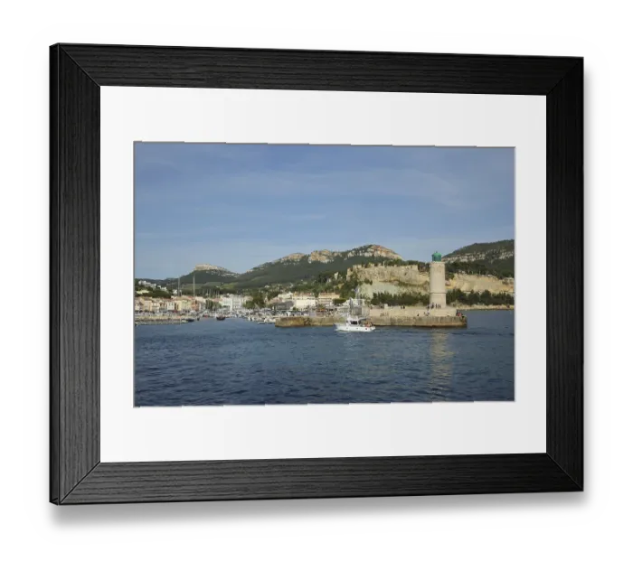 Framed Print : Bay with lighthouse and rocks, Mediterranean coast