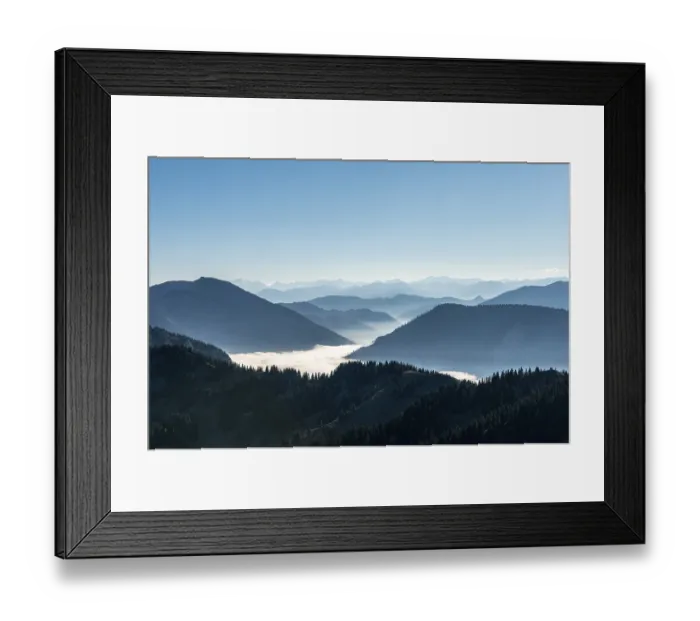Framed Print : Mountain chains one behind the other in back light