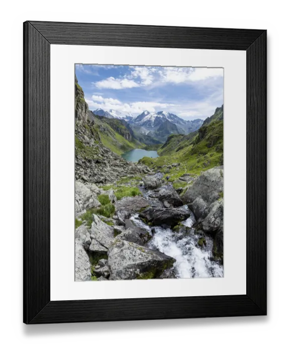 Framed Print : Mountain stream and mountain lake Lac de Louvie with glaciated summit of the Grand Combin