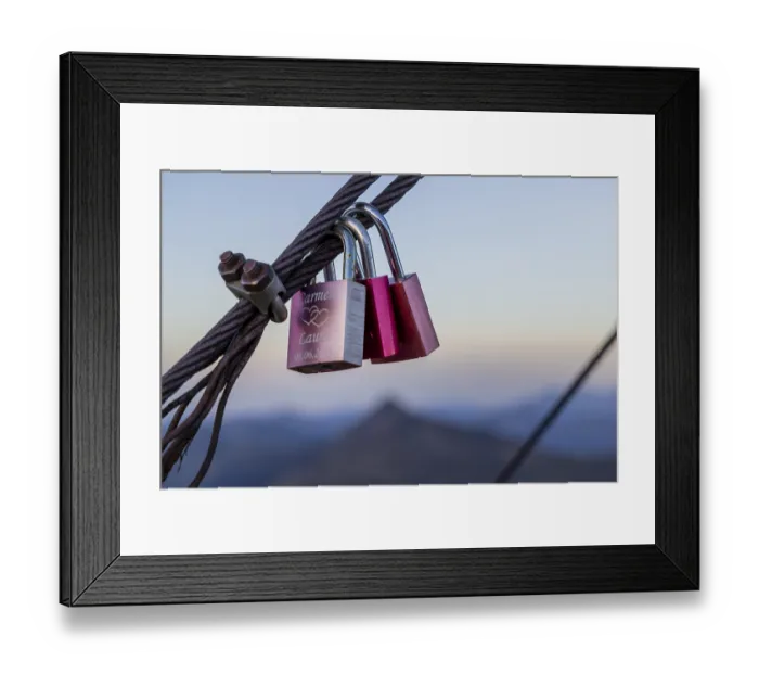 Framed Print : Two padlocks hanging on a metal rope with a mountain backdrop Framed Print : Two padlocks hanging on a metal rope with a mountain backdrop