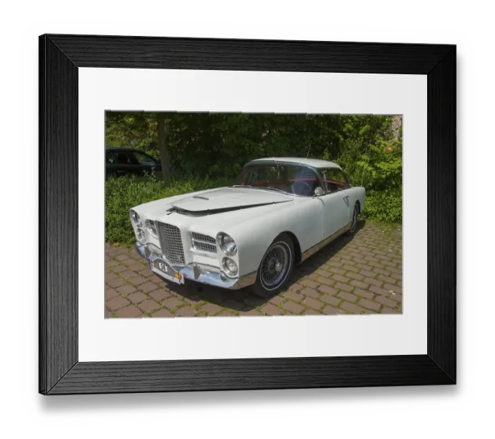 Framed Print : Elegant white classic car, shining in the sunlight on a paved square
