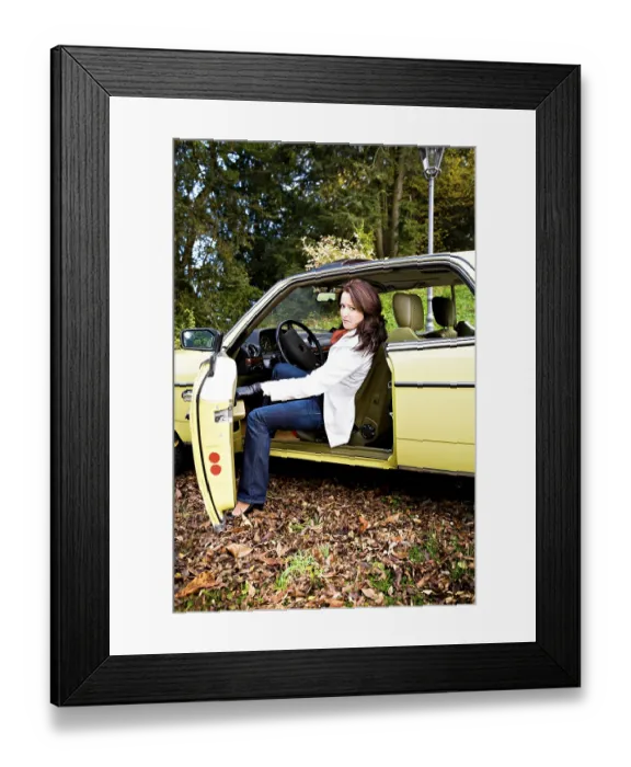 Framed Print : Young woman in a post-war classic car Framed Print : Young woman in a post-war classic car