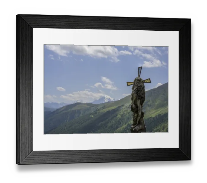 Framed Print : Wooden sculpture Four-man column behind it the Ortler