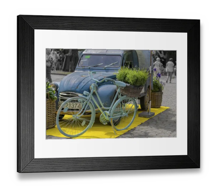 Framed Print : Vintage car, bicycle, flowers, decoration in front of castle Framed Print : Vintage car, bicycle, flowers, decoration in front of castle