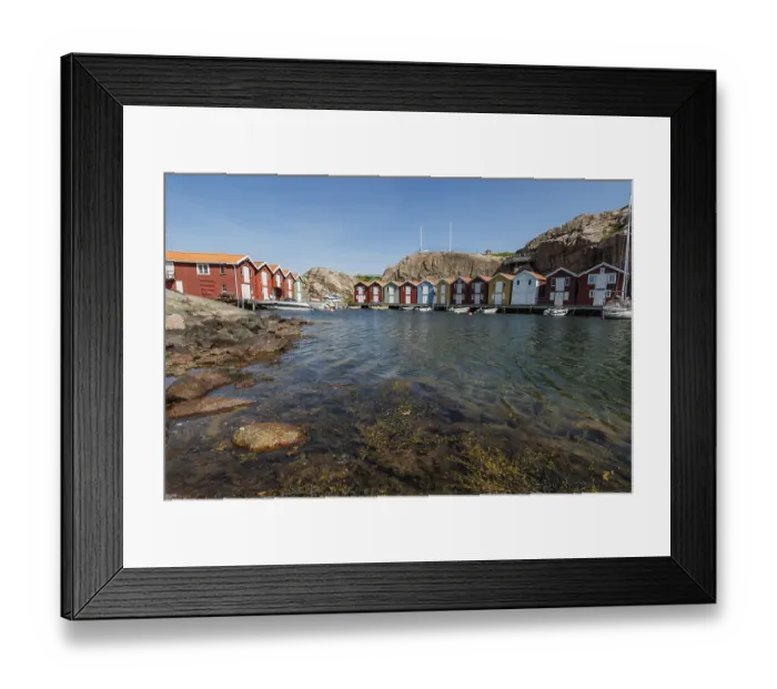 Framed Print : Boats and colourful boathouses in the harbour of Smoegen
