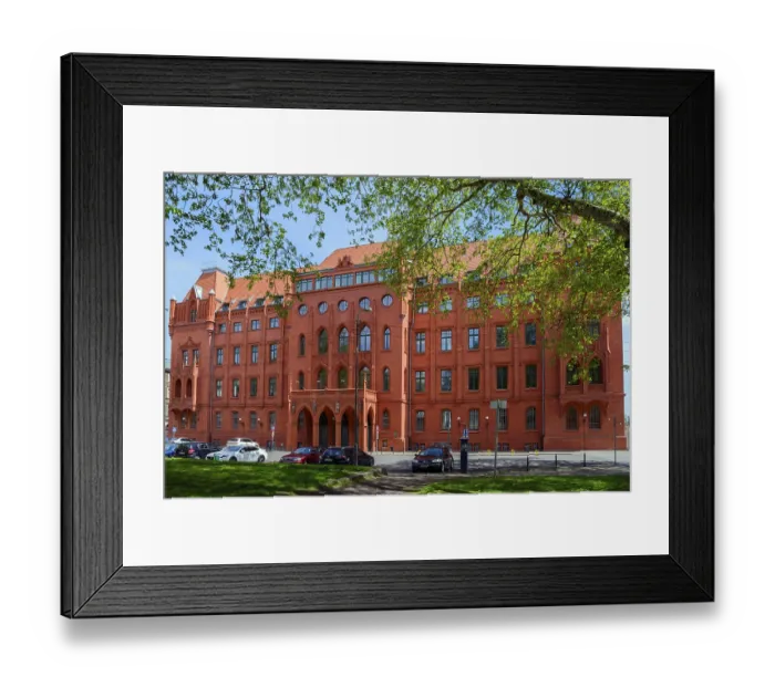 Framed Print : A historic red brick building in Gothic style on a sunny day with blue sky
