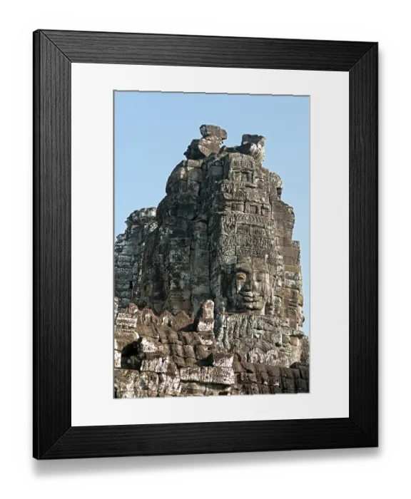 Framed Print : One of the more than 50 mystical towers of Bayon Temple with huge carved stone faces