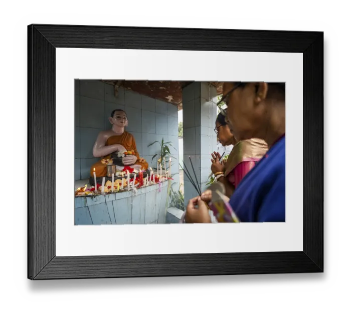 Framed Print : Devotees pray to Lord Buddha on the occasion of Buddha Purnima or Vesak Day that commemorates Gautam Buddha's
