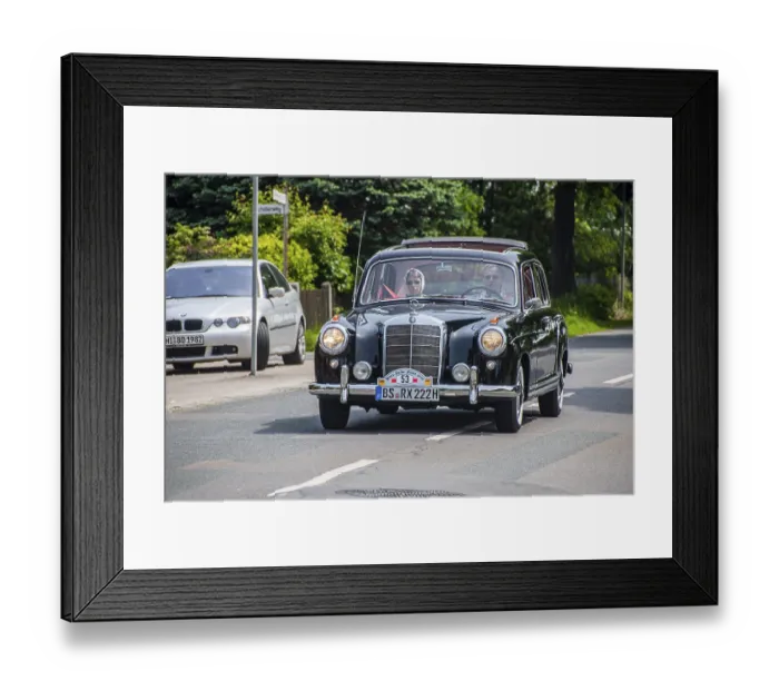 Framed Print : Elegant black Mercedes vintage car being driven on a quiet road