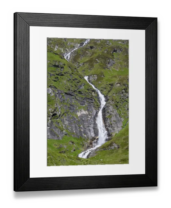 Framed Print : Waterfall on a green mountainside