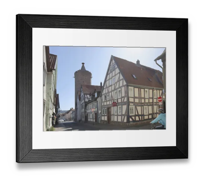 Framed Print : Historic Leonhard Tower built in 1386 and half-timbered house in Fuldauer Gasse