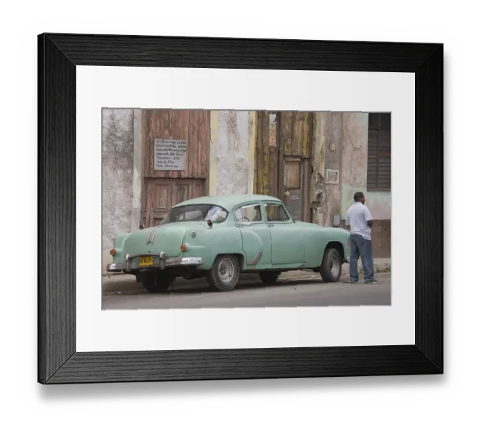 Framed Print : Local man standing next to a classic car