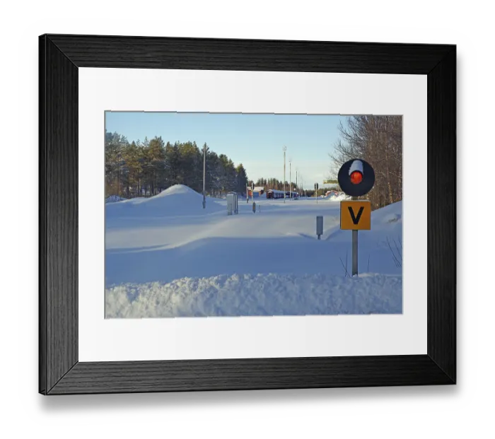 Framed Print : Snow-covered railway line and station Framed Print : Snow-covered railway line and station