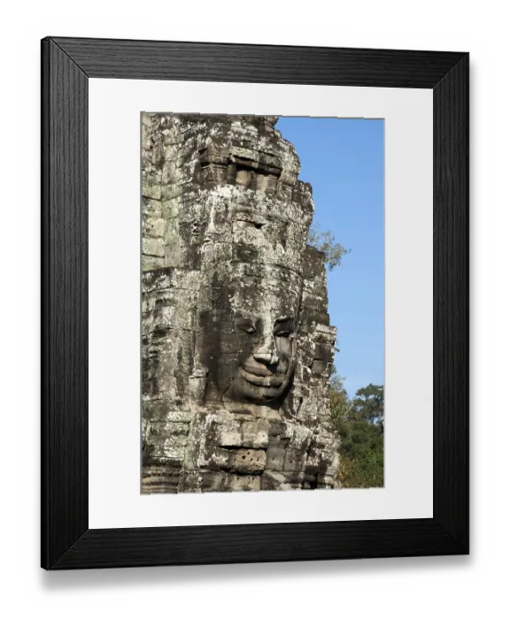 Framed Print : Smile of Angkor, huge face carved in stone on a tower