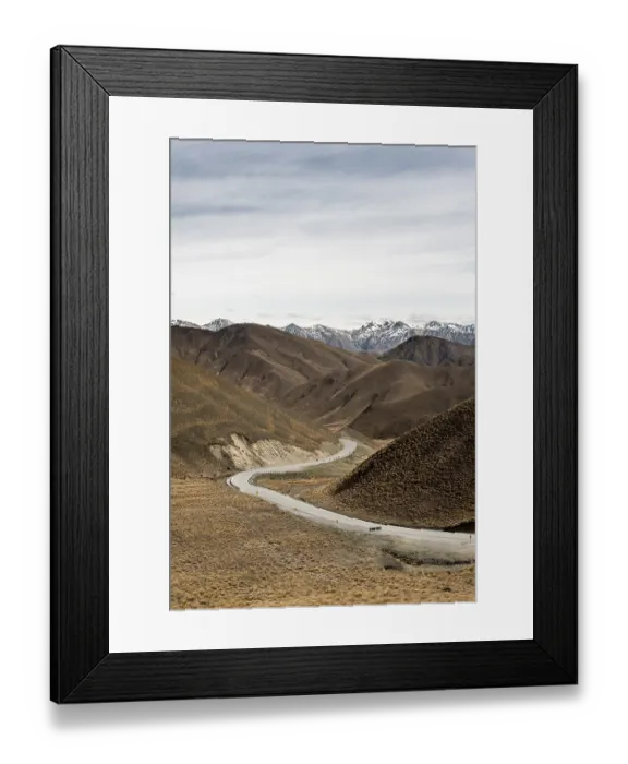 Framed Print : Barren mountain landscape with pass road
