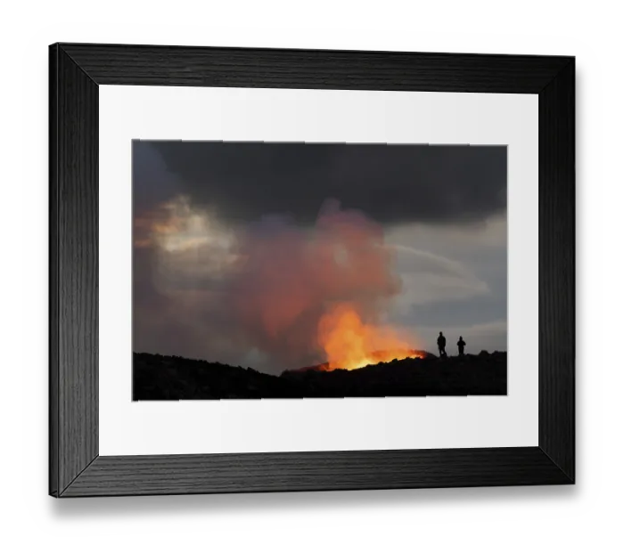Framed Print : Tourists in front of reddish illuminated smoke cloud