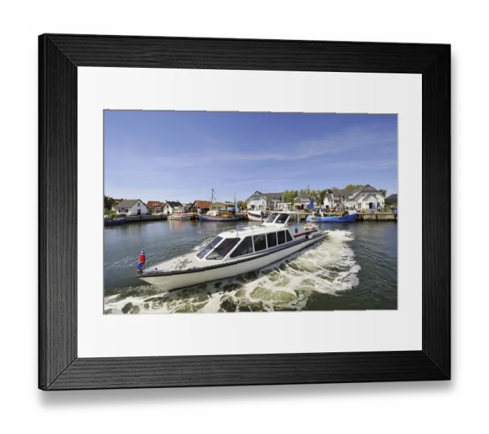 Framed Print : Water taxi 'MY Pirat' in a turning maneuvre in the harbour of Vitte