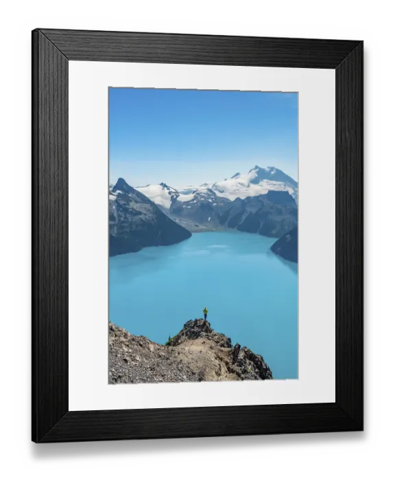 Framed Print : Young man standing on a rock, looking into the distance Framed Print : Young man standing on a rock, looking into the distance