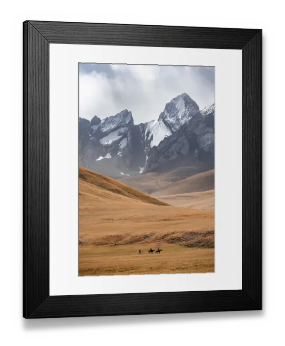 Framed Print : Rider in front of mountain landscape with yellow meadows