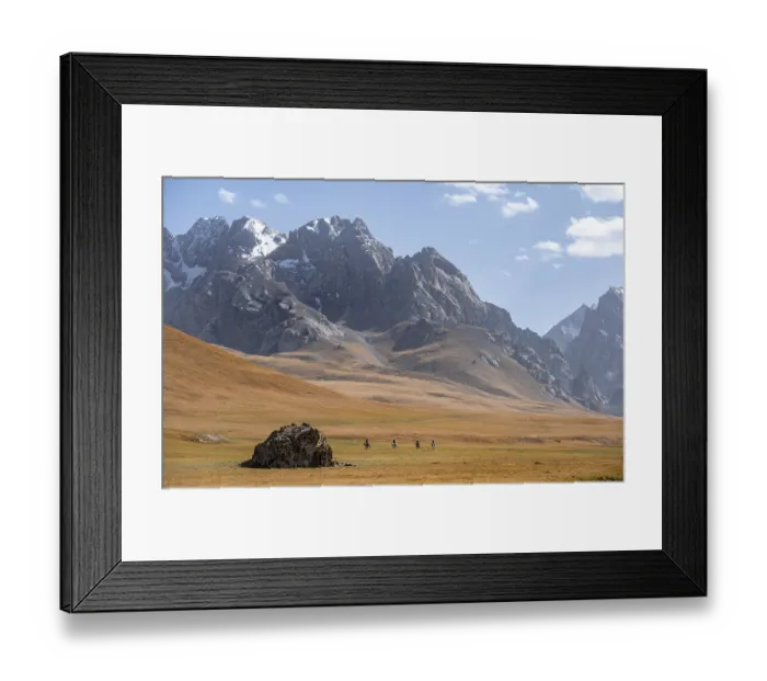 Framed Print : Rider in mountain landscape with yellow meadows Framed Print : Rider in mountain landscape with yellow meadows