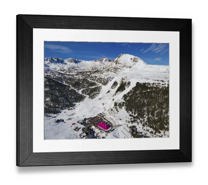 Framed Print : Aerial view of a mountain station with surrounding ski slopes in a winter landscape Framed Print : Aerial view of a mountain station with surrounding ski slopes in a winter landscape