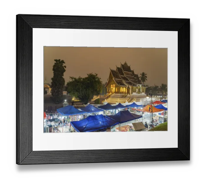 Framed Print : Night market and the Haw Pha Bang temple of the Royal Palace in Luang Prabang at dusk