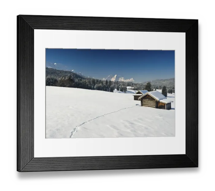 Framed Print : Snow-covered pastures and hay barns