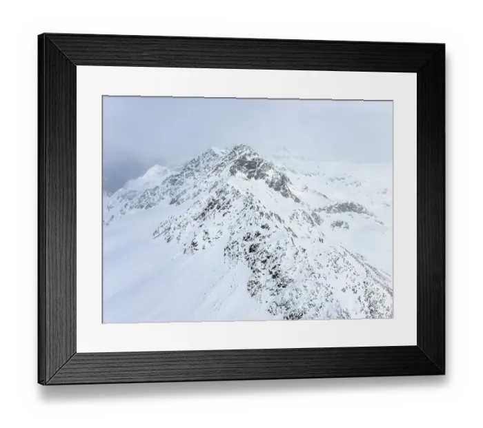 Framed Print : Aerial view, Snowy mountain landscape in fog