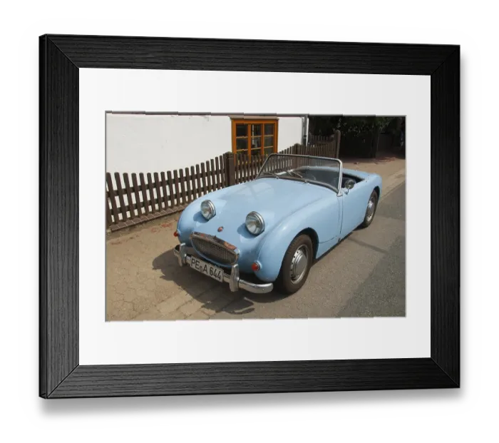 Framed Print : Small blue Austin Healey convertible classic car parked in urban environment Framed Print : Small blue Austin Healey convertible classic car parked in urban environment