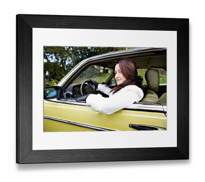 Framed Print : Young woman in a post-war classic car