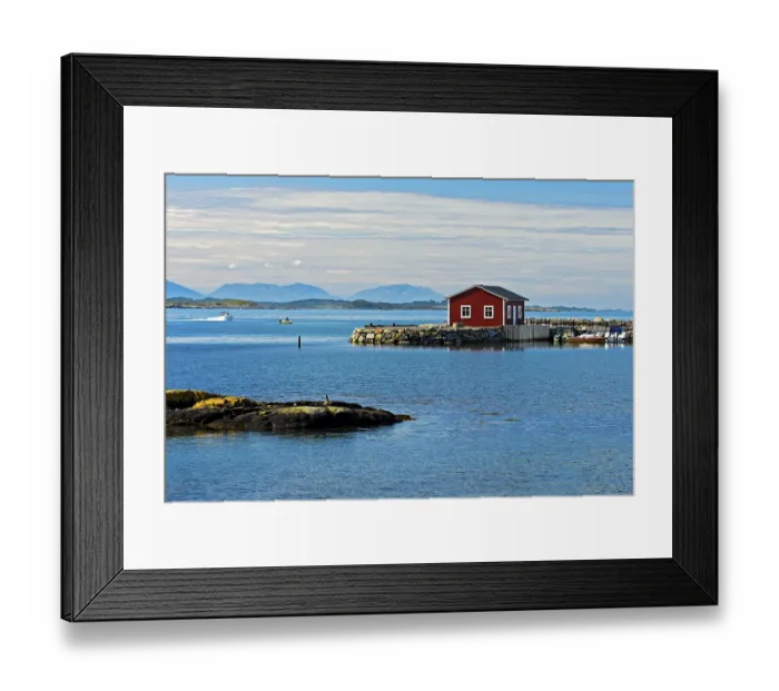 Framed Print : Lonely red wooden house at a bay near Bud