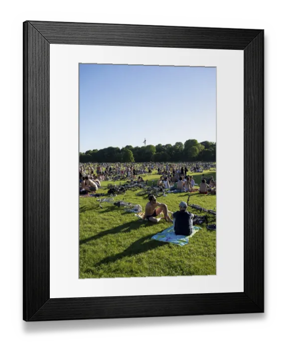 Framed Print : Many people sitting relaxed in the English Garden on a summer's day Framed Print : Many people sitting relaxed in the English Garden on a summer's day