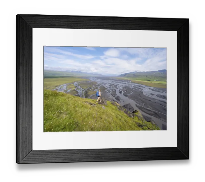 Framed Print : Hiker, Young woman on a hill, view over alluvial land