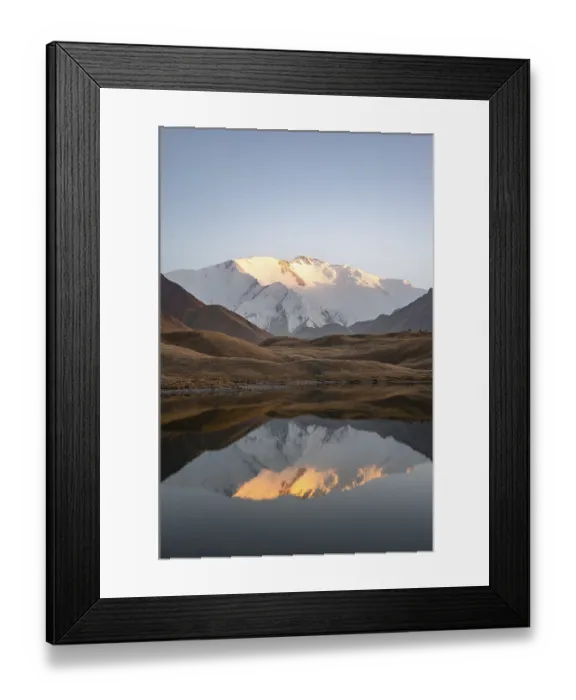 Framed Print : White glaciated and snowy mountain peak Pik Lenin at sunset