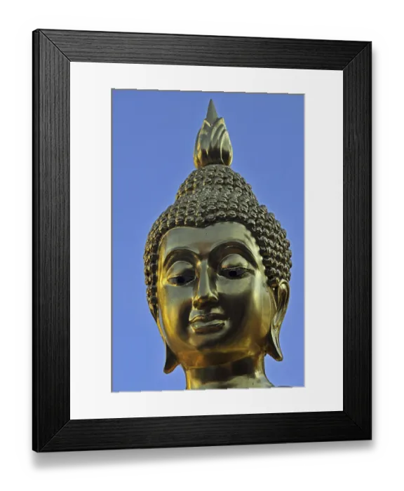 Framed Print : Golden Buddha statue with flame of enlightenment Framed Print : Golden Buddha statue with flame of enlightenment