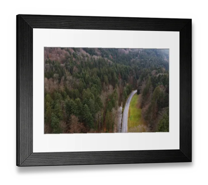 Framed Print : Drone shot, Wangauer Ache with federal road and autumnal mixed forest from above Framed Print : Drone shot, Wangauer Ache with federal road and autumnal mixed forest from above