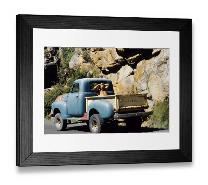 Framed Print : Shirtless young man sitting in the back of an old Chevrolet pick-up truck Framed Print : Shirtless young man sitting in the back of an old Chevrolet pick-up truck