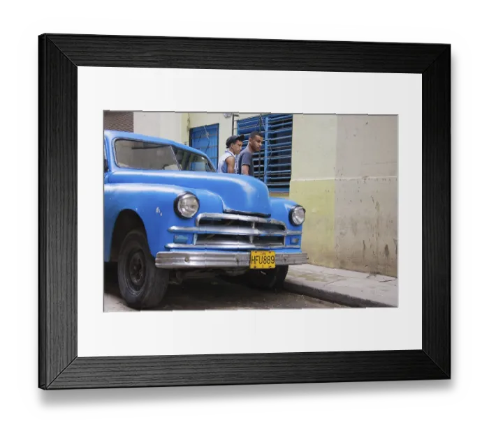 Framed Print : Two men standing behind a classic car