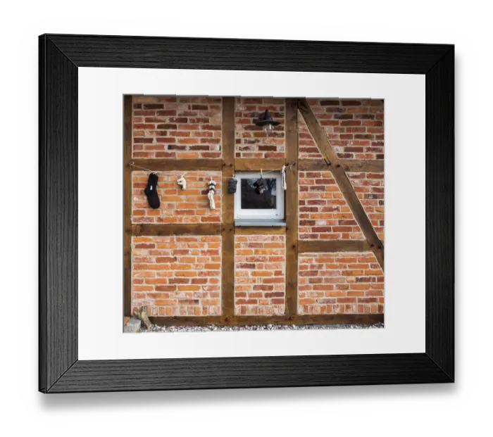 Framed Print : Facade of a half-timbered house on the island of Ruegen