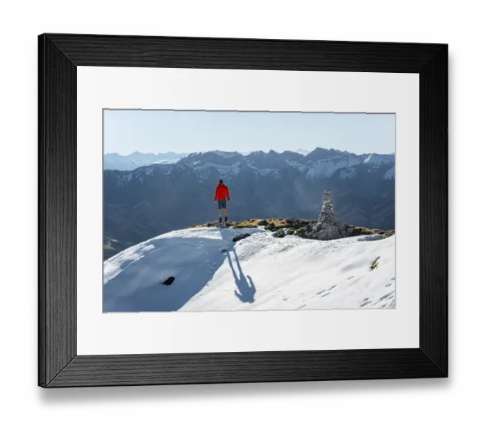 Framed Print : Mountaineer next to a cairn, in front of snowy mountains of the Rofan Framed Print : Mountaineer next to a cairn, in front of snowy mountains of the Rofan