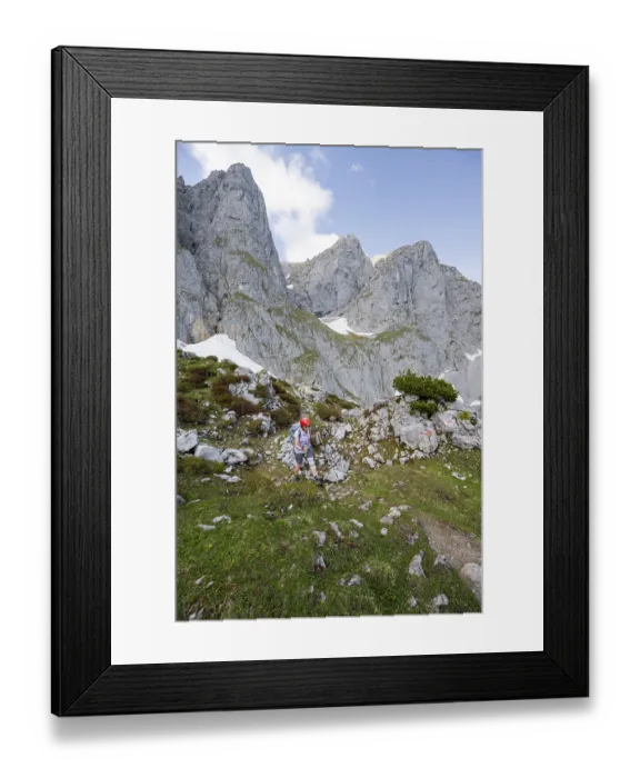 Framed Print : Mountaineer with helmet on a hiking trail