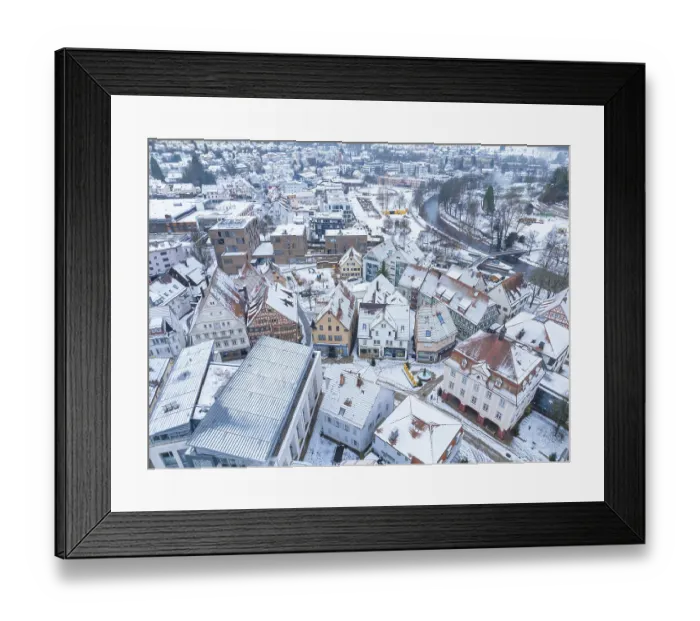 Framed Print : View of the picturesque old town with ornate architecture and snow-covered roofs