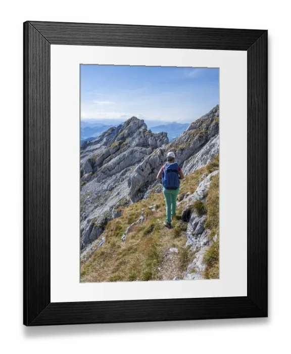 Framed Print : Hiker with climbing helmet on a hiking trail