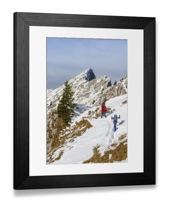 Framed Print : Climbers in the snow, hiking trail in winter