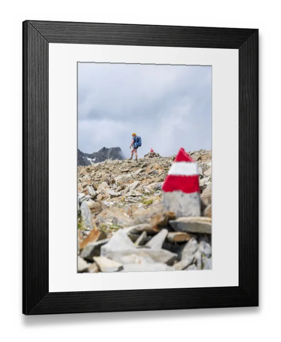Framed Print : Red and white trail markings, hiker in the high mountains